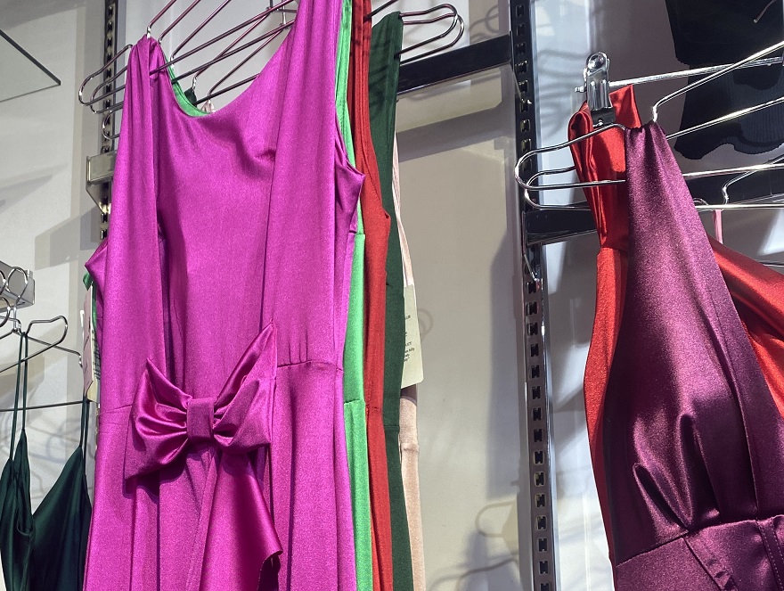 new evening dresses on store hangers