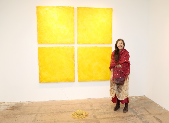 Sono Kuwayama poses with her artwork at Ki Smith Gallery.