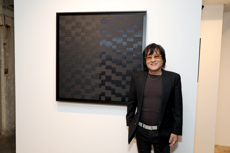 Taiji Terasaki poses with his artwork at Ki Smith Gallery.